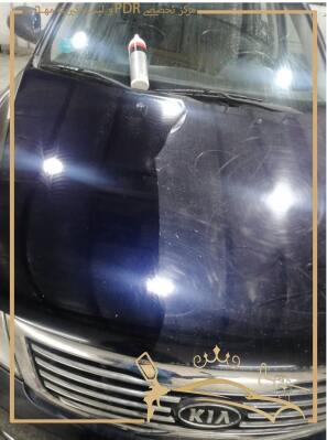 اجرای خدمات واکس و پولیش بدنه خودور مشکی 
